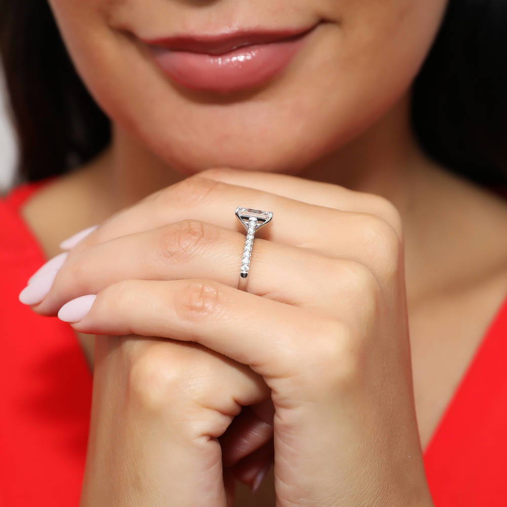 Model wearing Solitaire 2.6ct Emerald Cut CZ Ring in Sterling Silver, 6 of 9