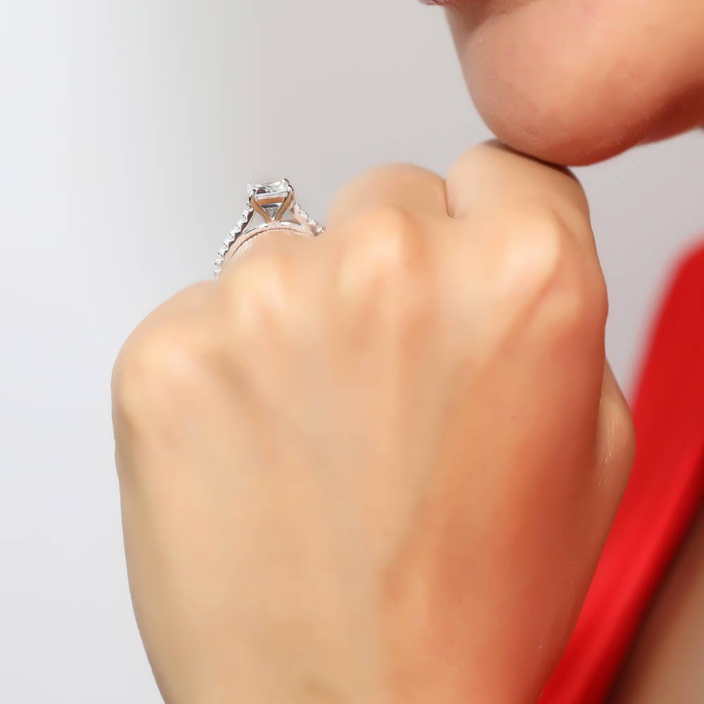 Model wearing Solitaire 2.6ct Emerald Cut CZ Ring in Sterling Silver, 2 of 9