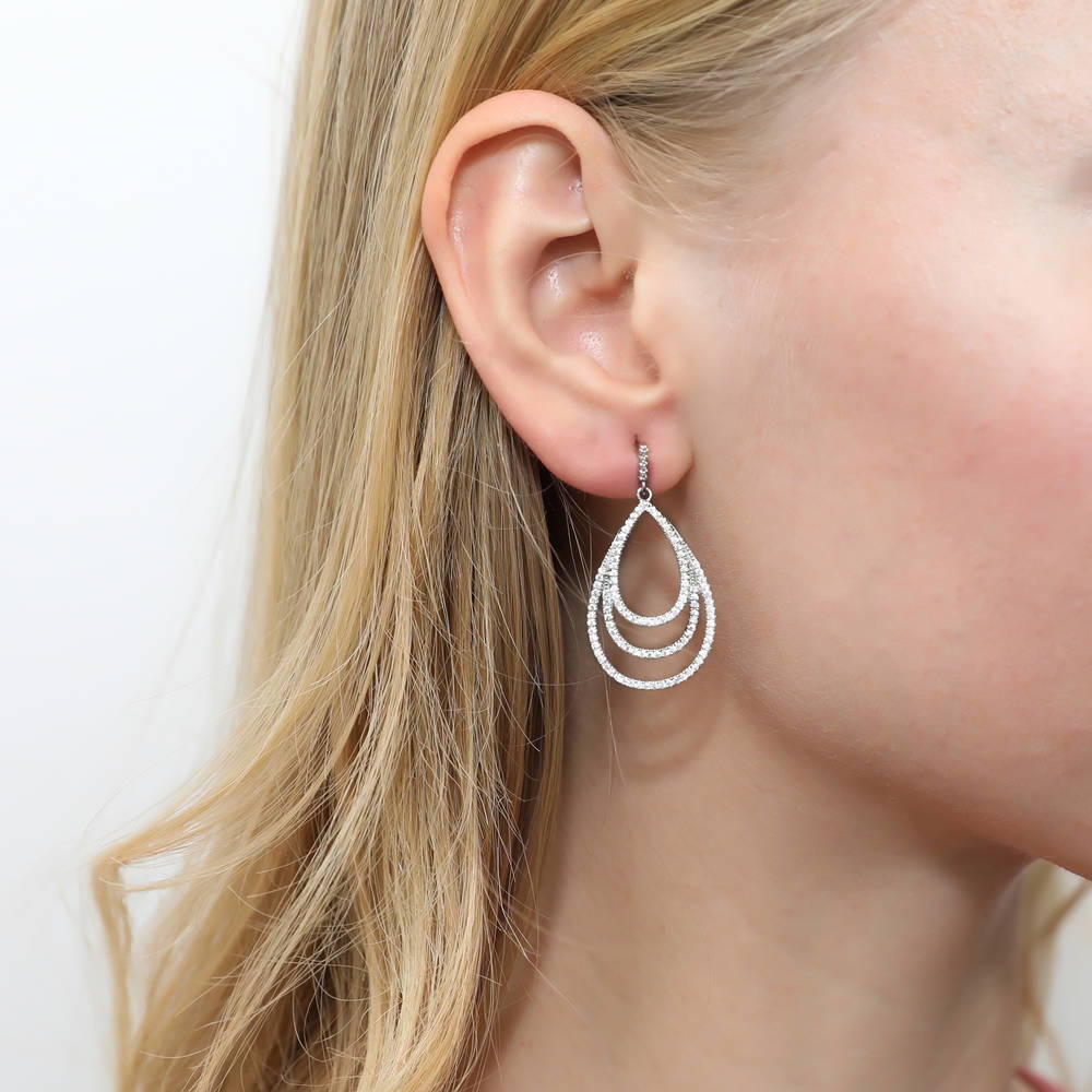 Model wearing Teardrop CZ Dangle Earrings in Sterling Silver, 3 of 5