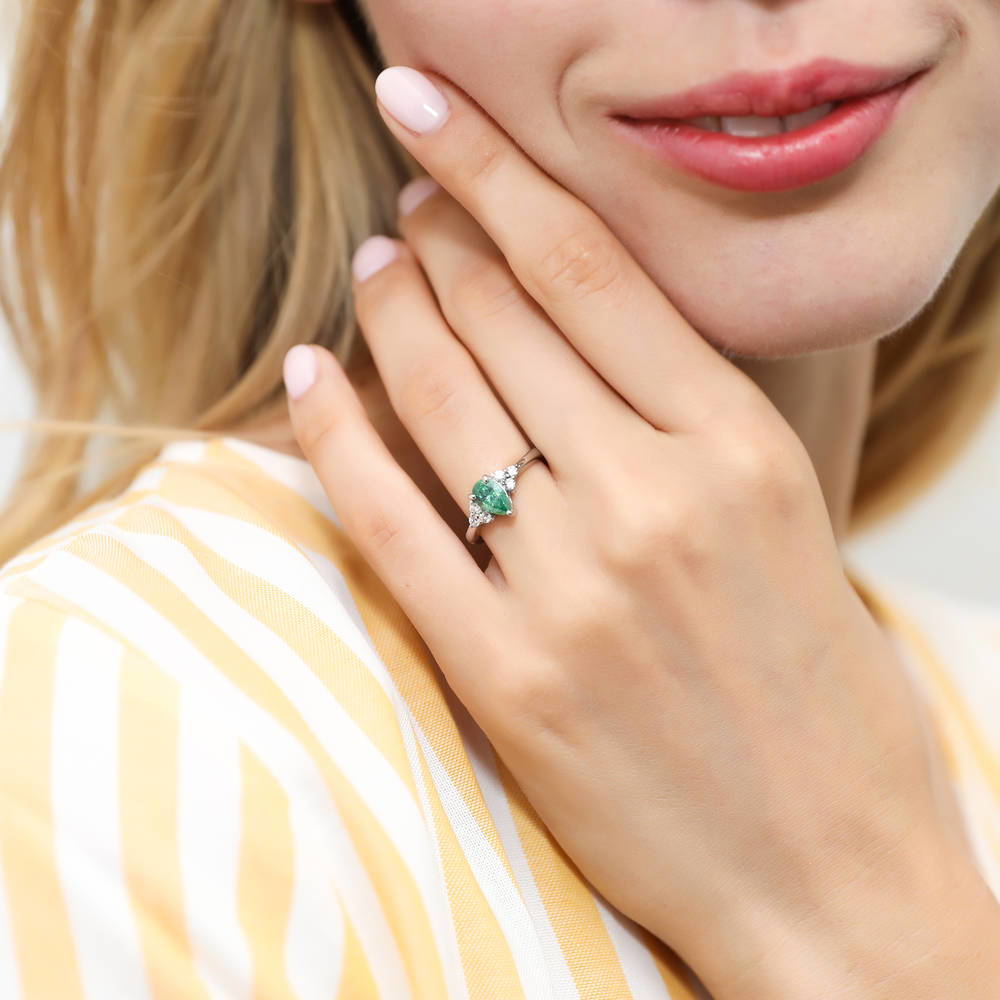 Model wearing Solitaire 0.8ct Green Pear CZ Ring in Sterling Silver, 2 of 8