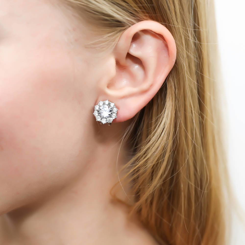 Model wearing Flower Halo CZ Omega Back Stud Earrings in Sterling Silver, 2 of 6