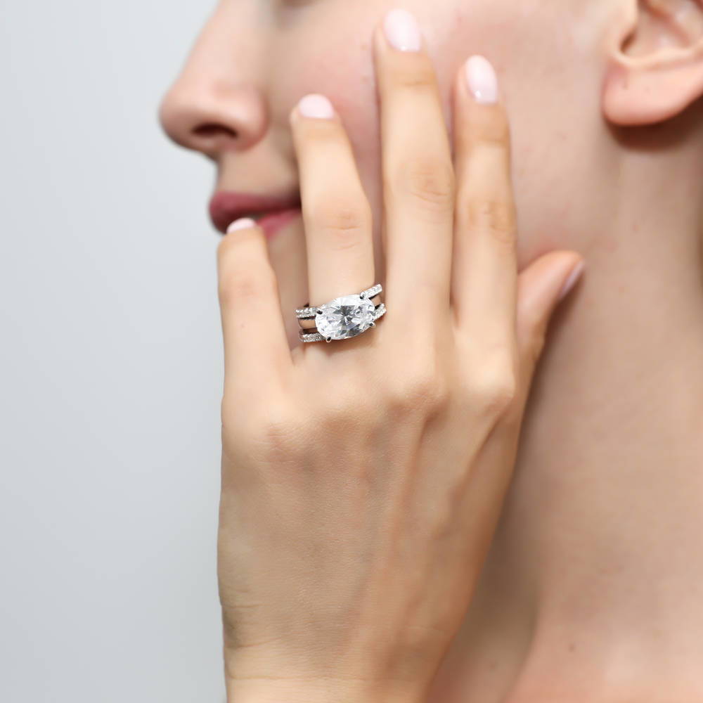 Model wearing East-West Solitaire CZ Ring Set in Sterling Silver, 2 of 11