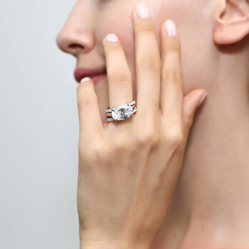 Model wearing Solitaire East-West 5.5ct Oval CZ Ring Set in Sterling Silver, 2 of 12