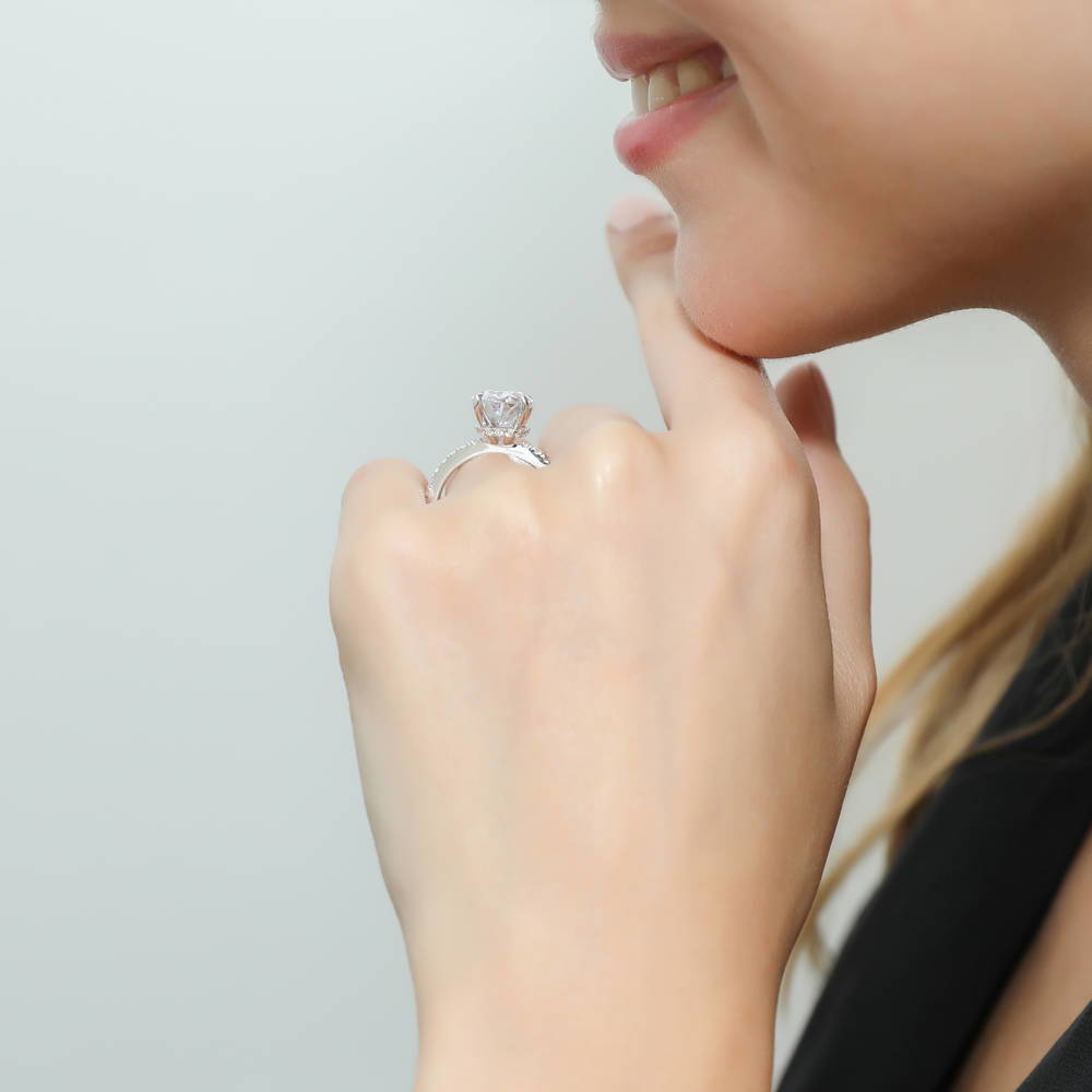 Model wearing Solitaire Hidden Halo 5.5ct Oval CZ Ring in Sterling Silver, 3 of 8