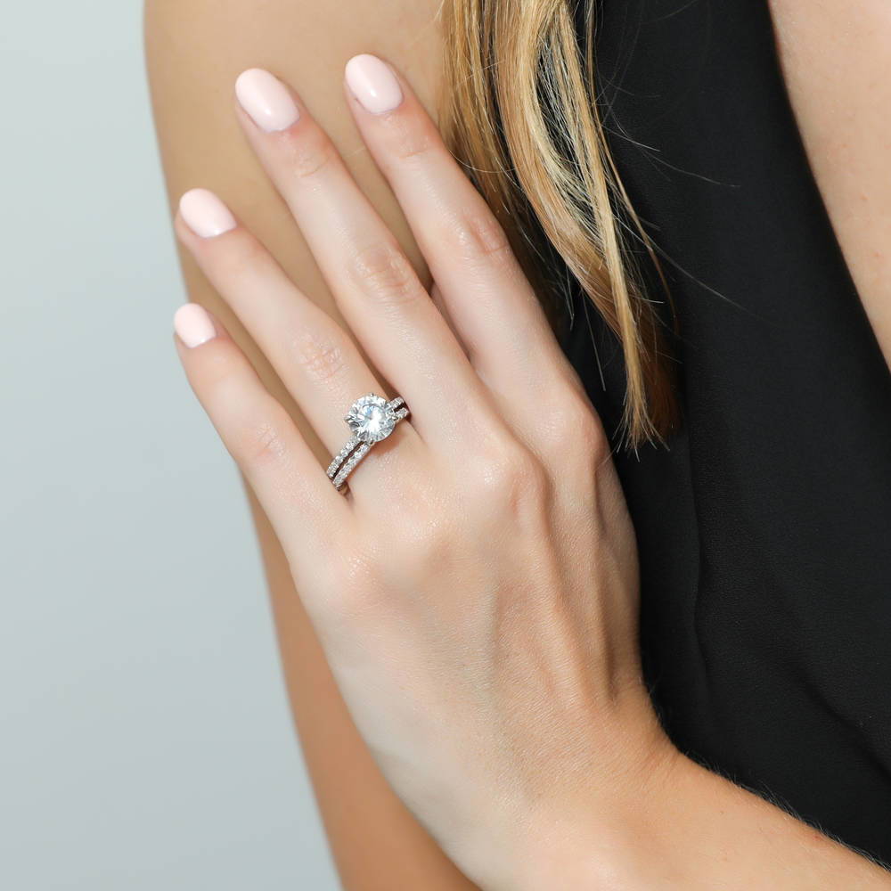 Model wearing Hidden Halo Solitaire CZ Ring Set in Sterling Silver, 2 of 12
