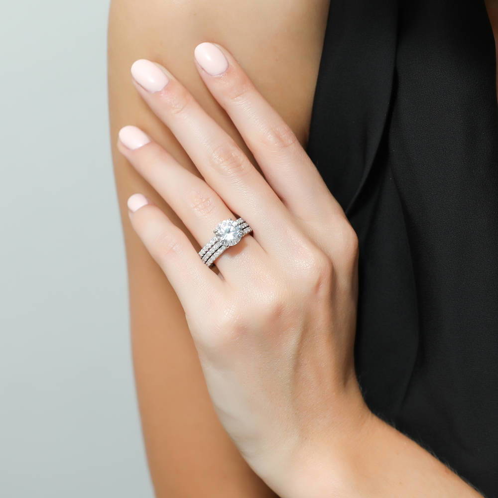 Model wearing Hidden Halo Solitaire CZ Ring Set in Sterling Silver, 2 of 11