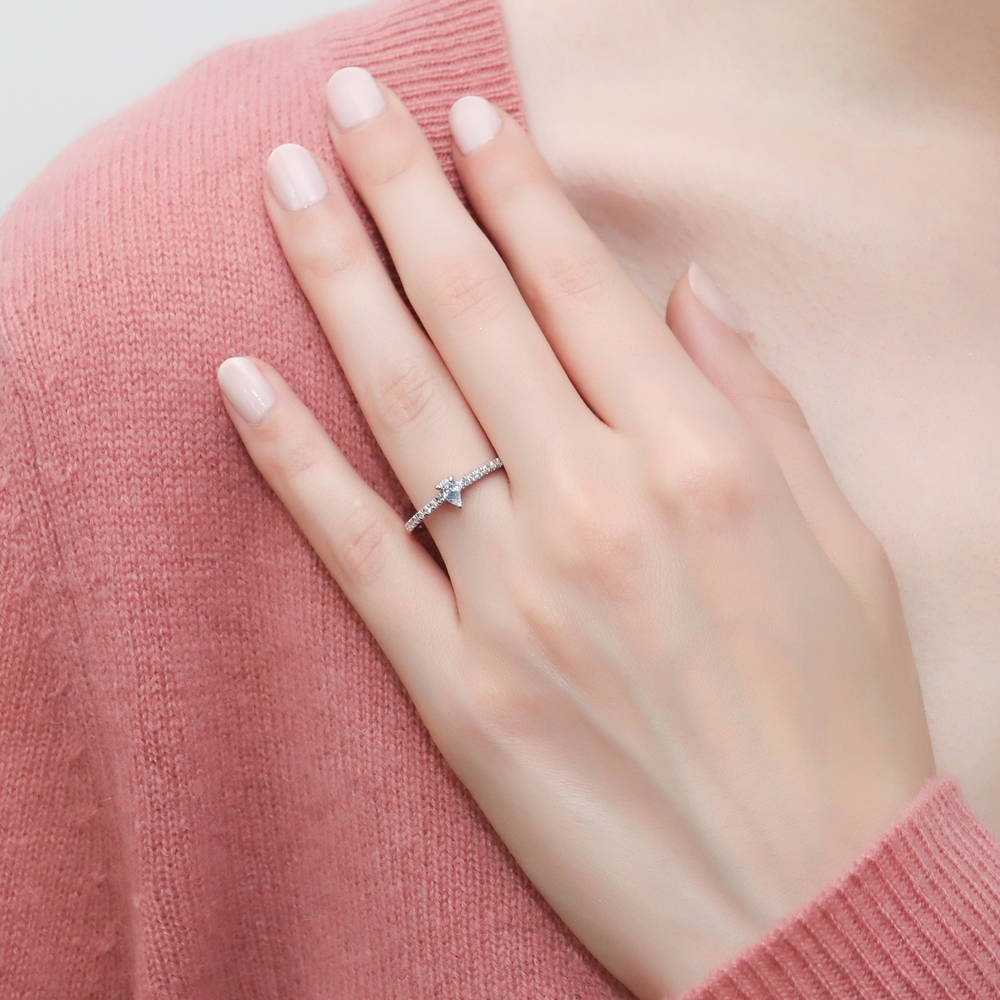 Model wearing Solitaire 0.3ct Pear CZ Ring in Sterling Silver, 3 of 11