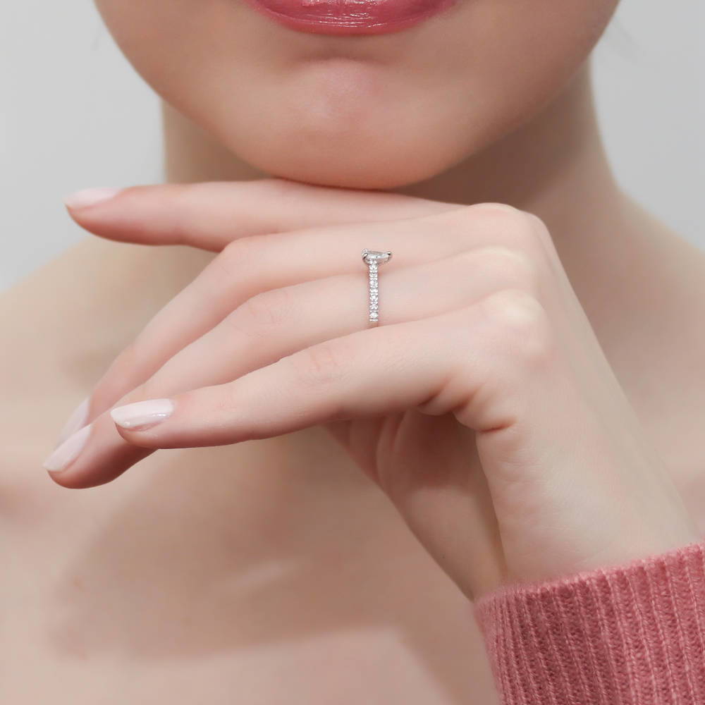 Model wearing Solitaire 0.3ct Pear CZ Ring in Sterling Silver, 10 of 11