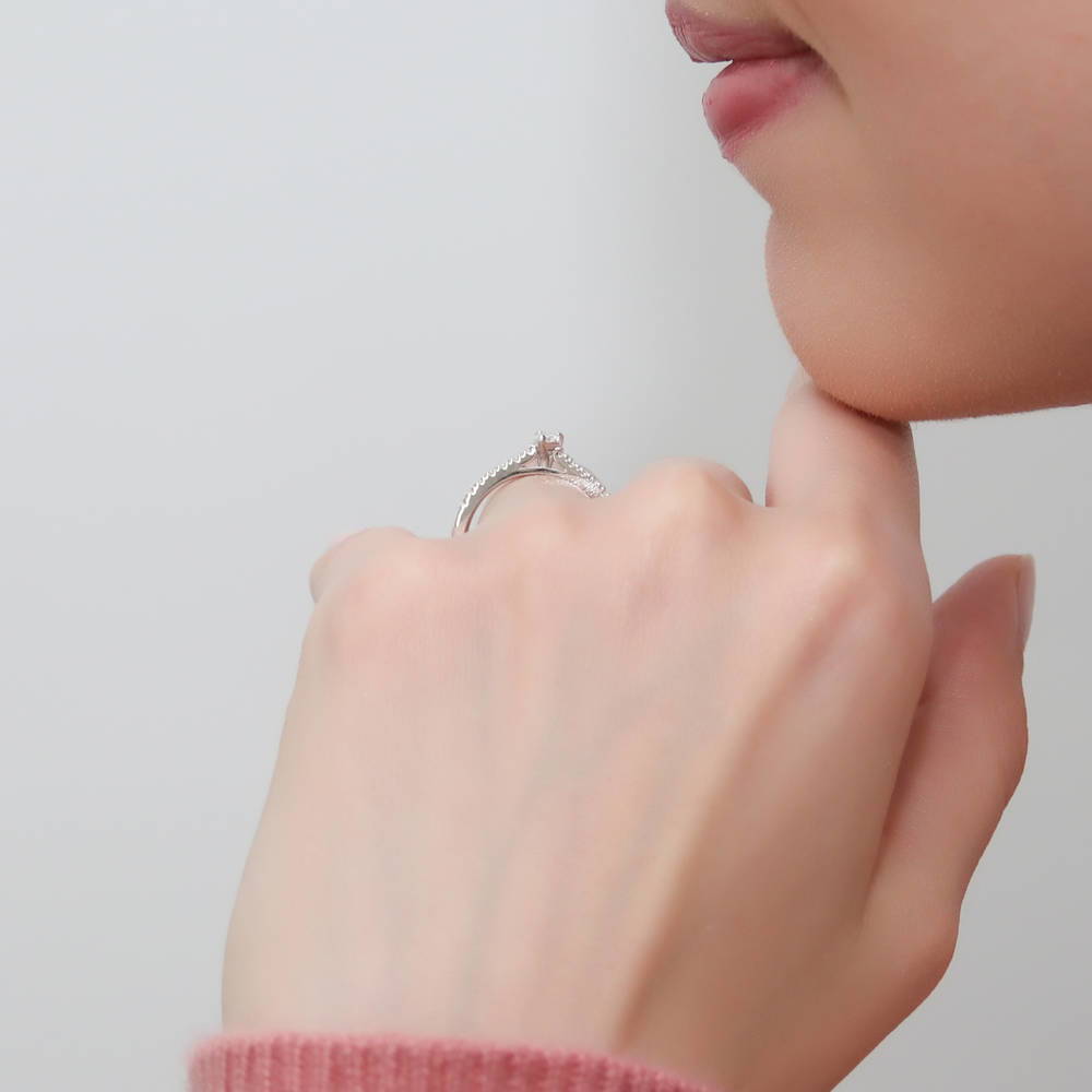Model wearing Solitaire 0.3ct Pear CZ Ring in Sterling Silver, 9 of 11