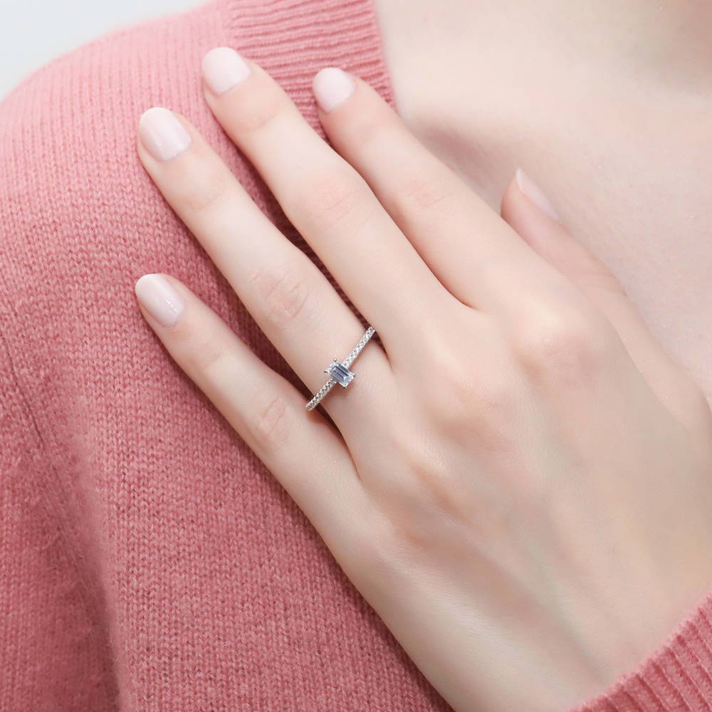 Model wearing Solitaire 0.3ct Emerald Cut CZ Ring in Sterling Silver, 2 of 9