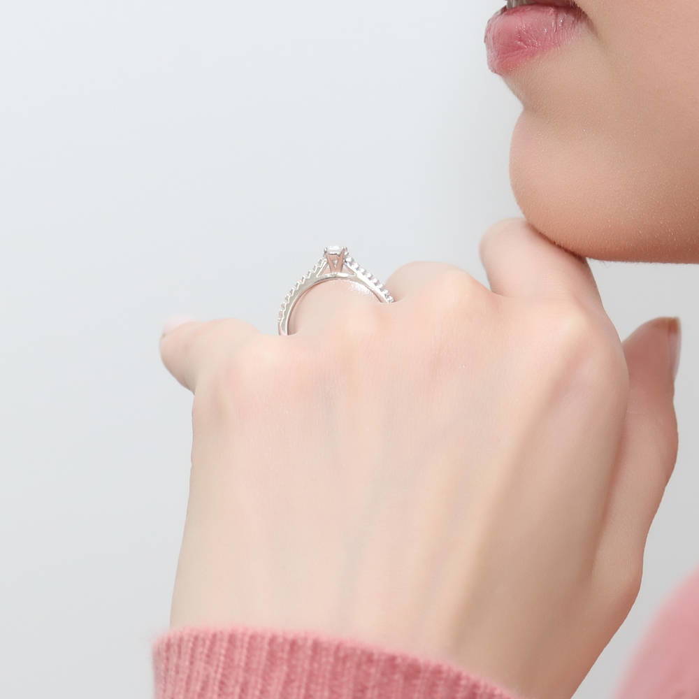 Model wearing Solitaire 0.3ct Emerald Cut CZ Ring in Sterling Silver, 3 of 9