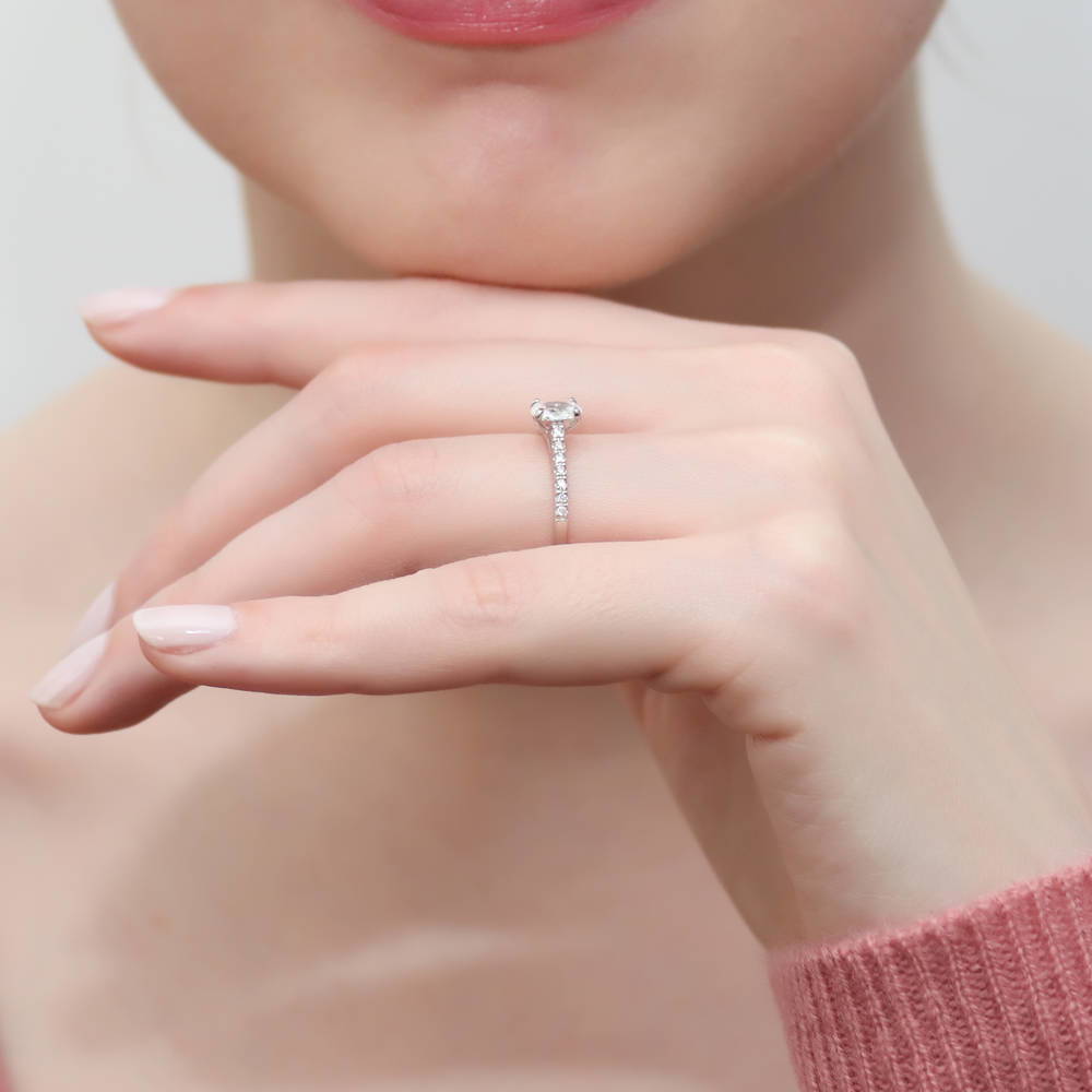 Model wearing Solitaire 0.4ct Oval CZ Ring in Sterling Silver, 6 of 9