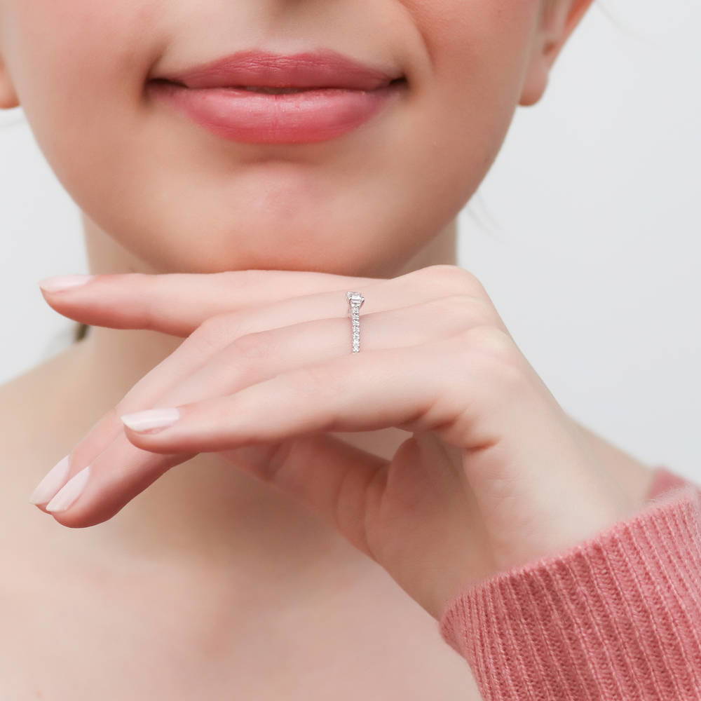 Model wearing Solitaire East-West 0.3ct Emerald Cut CZ Ring in Sterling Silver, 6 of 9