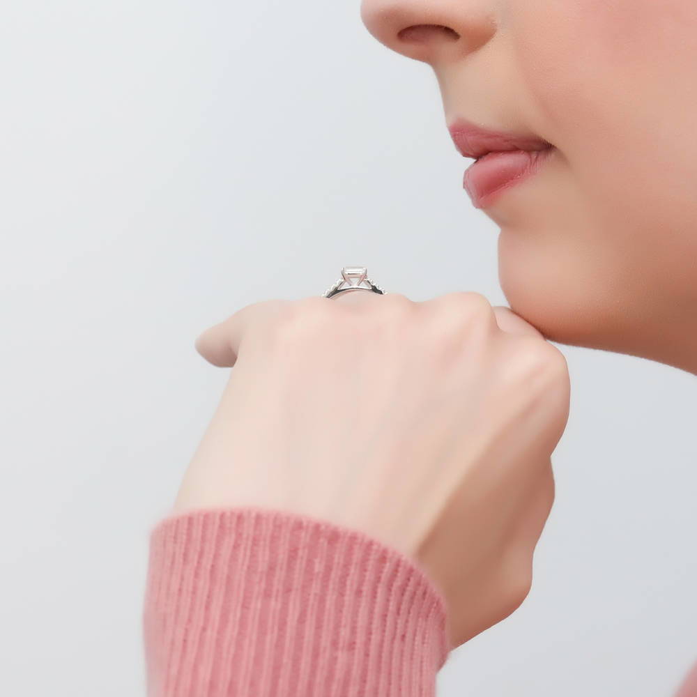Model wearing Solitaire East-West 0.3ct Emerald Cut CZ Ring in Sterling Silver, 3 of 9