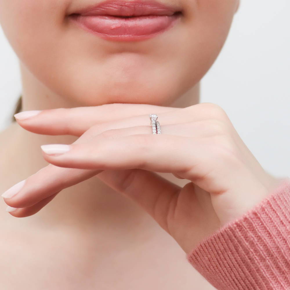Model wearing Solitaire East-West 0.3ct Emerald Cut CZ Ring in Sterling Silver, 11 of 12