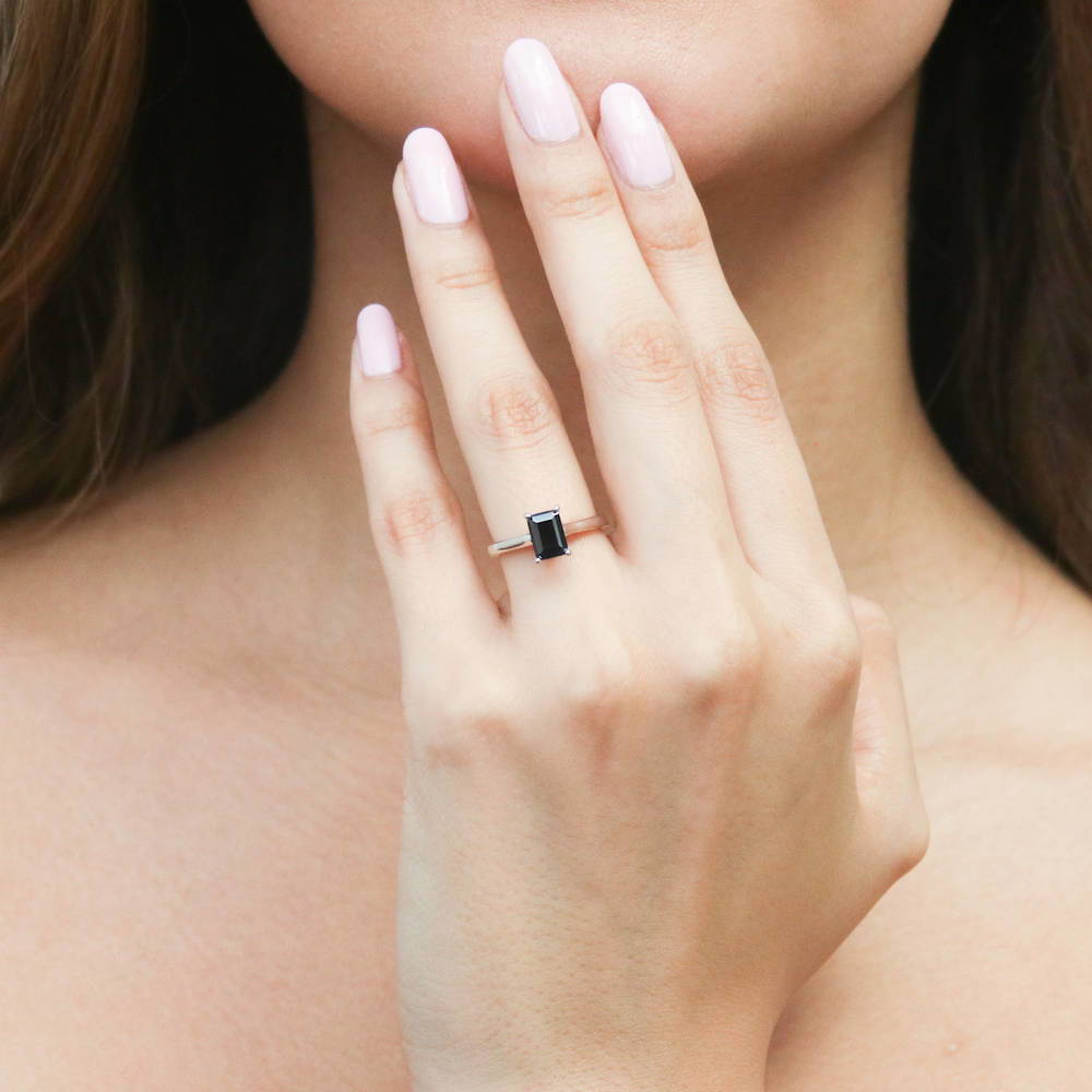 Model wearing Solitaire 1ct Black Emerald Cut CZ Ring in Sterling Silver, 2 of 11