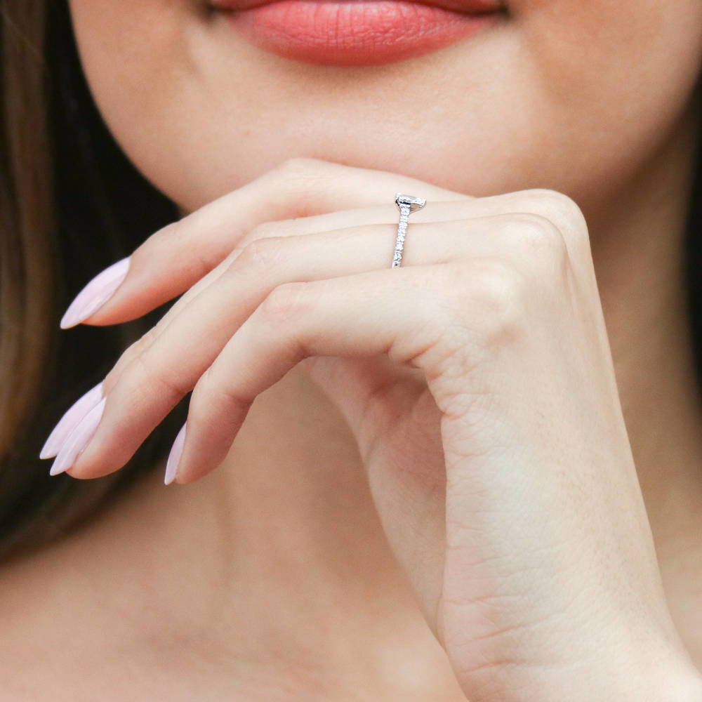 Model wearing Solitaire 0.3ct Pear CZ Ring in Sterling Silver, 7 of 11