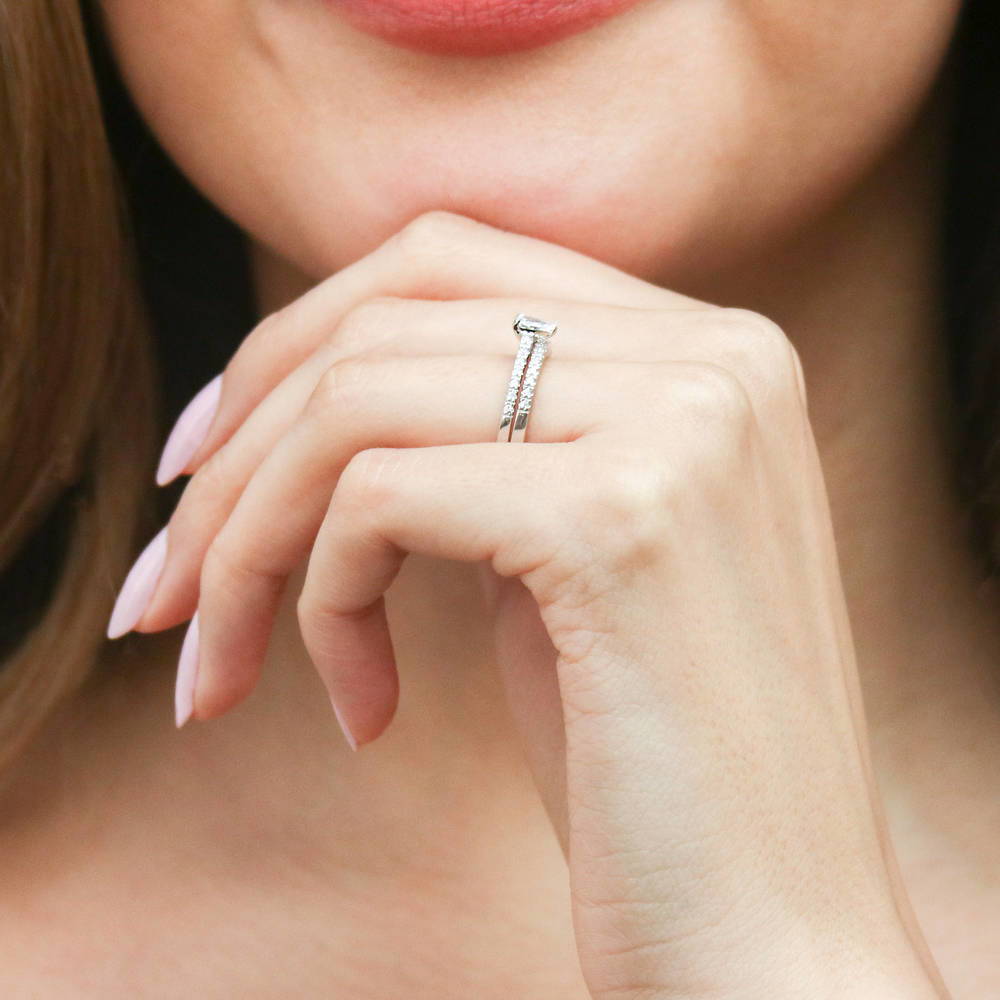 Model wearing Solitaire 0.3ct Pear CZ Ring Set in Sterling Silver, 6 of 17