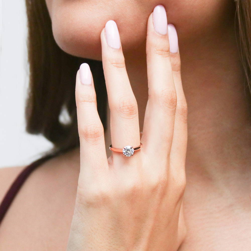 Model wearing Solitaire 0.8ct Round CZ Ring in Rose Gold Plated Sterling Silver, 3 of 8