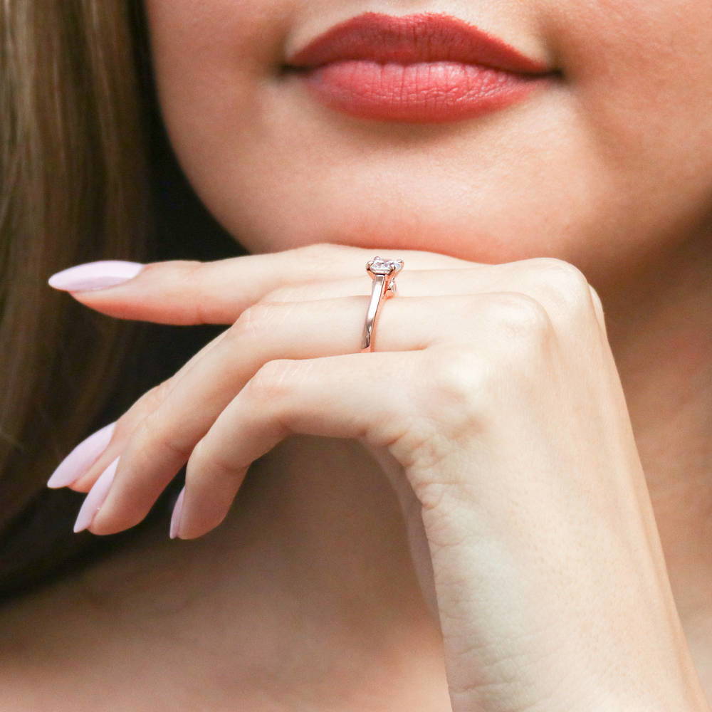 Model wearing Solitaire 0.8ct Round CZ Ring in Rose Gold Plated Sterling Silver, 6 of 8