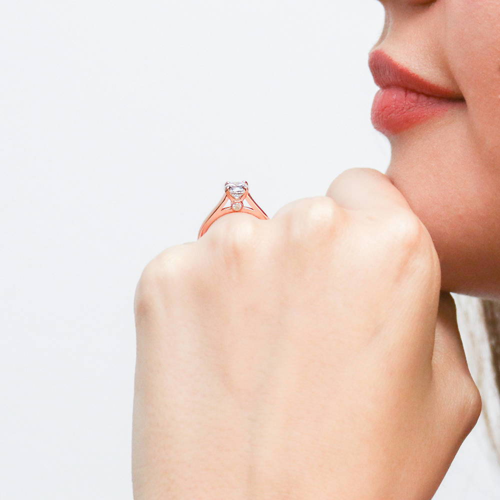 Model wearing Solitaire 0.8ct Round CZ Ring in Rose Gold Plated Sterling Silver, 2 of 8