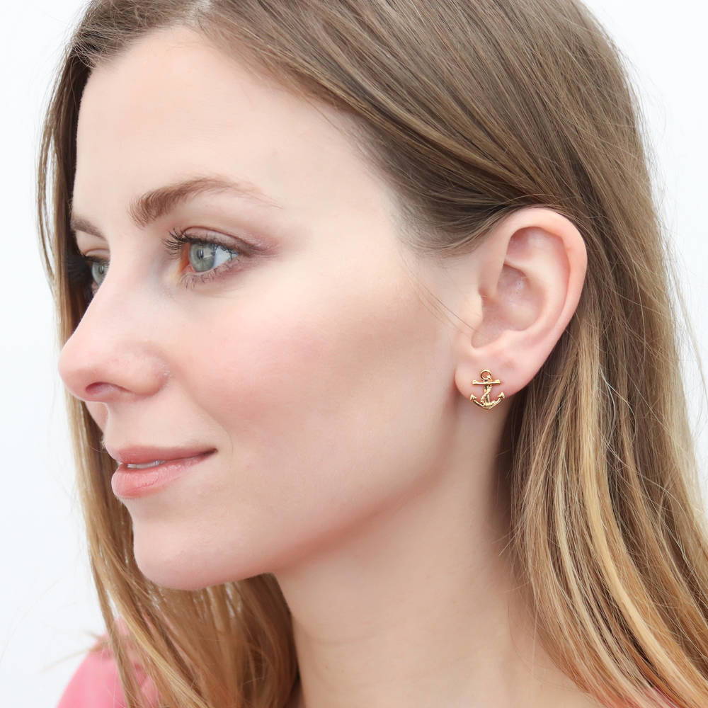 Model wearing Anchor Stud Earrings in Sterling Silver, Yellow Gold Flashed