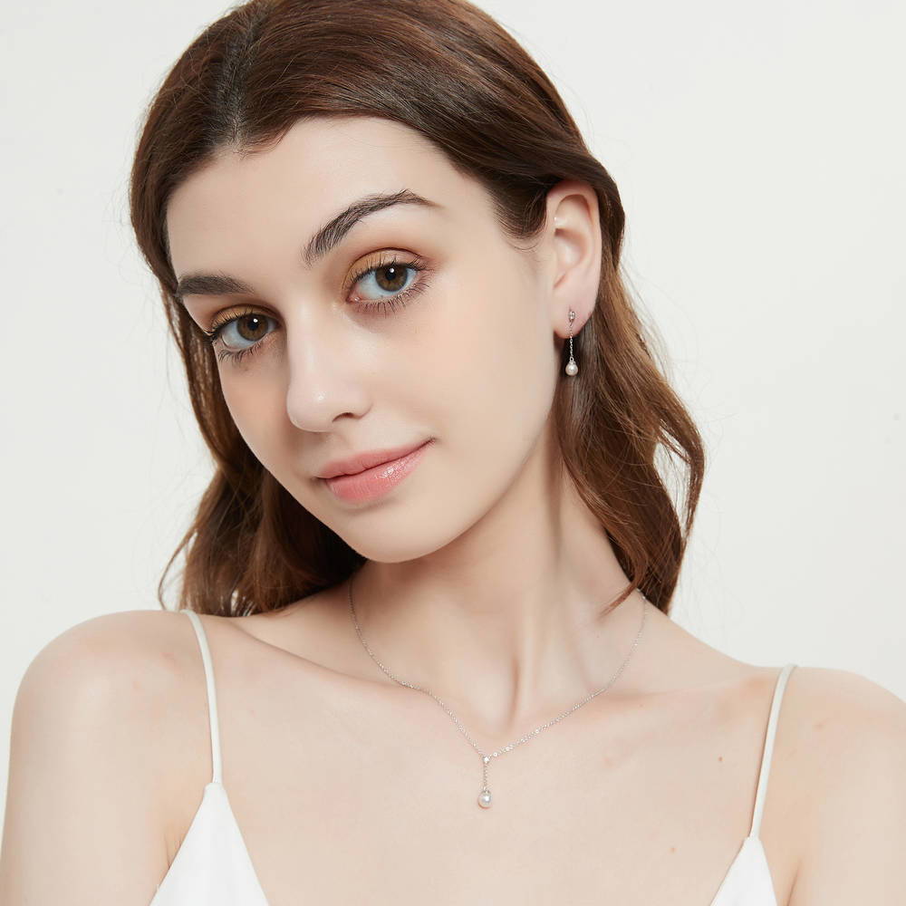 Model wearing Solitaire Imitation Pearl Necklace in Sterling Silver, 3 of 6