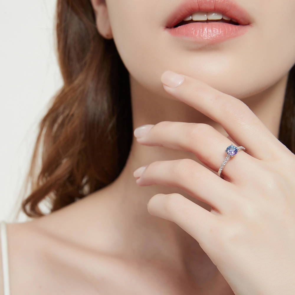Model wearing Solitaire Kaleidoscope Purple Aqua CZ Ring in Sterling Silver, 2 of 8