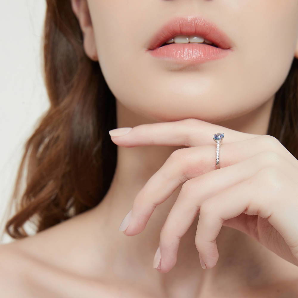 Model wearing Solitaire Kaleidoscope Purple Aqua CZ Ring in Sterling Silver, 6 of 8