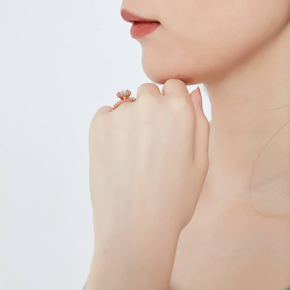Model wearing Halo Round CZ Ring in Rose Gold Plated Sterling Silver, 3 of 8