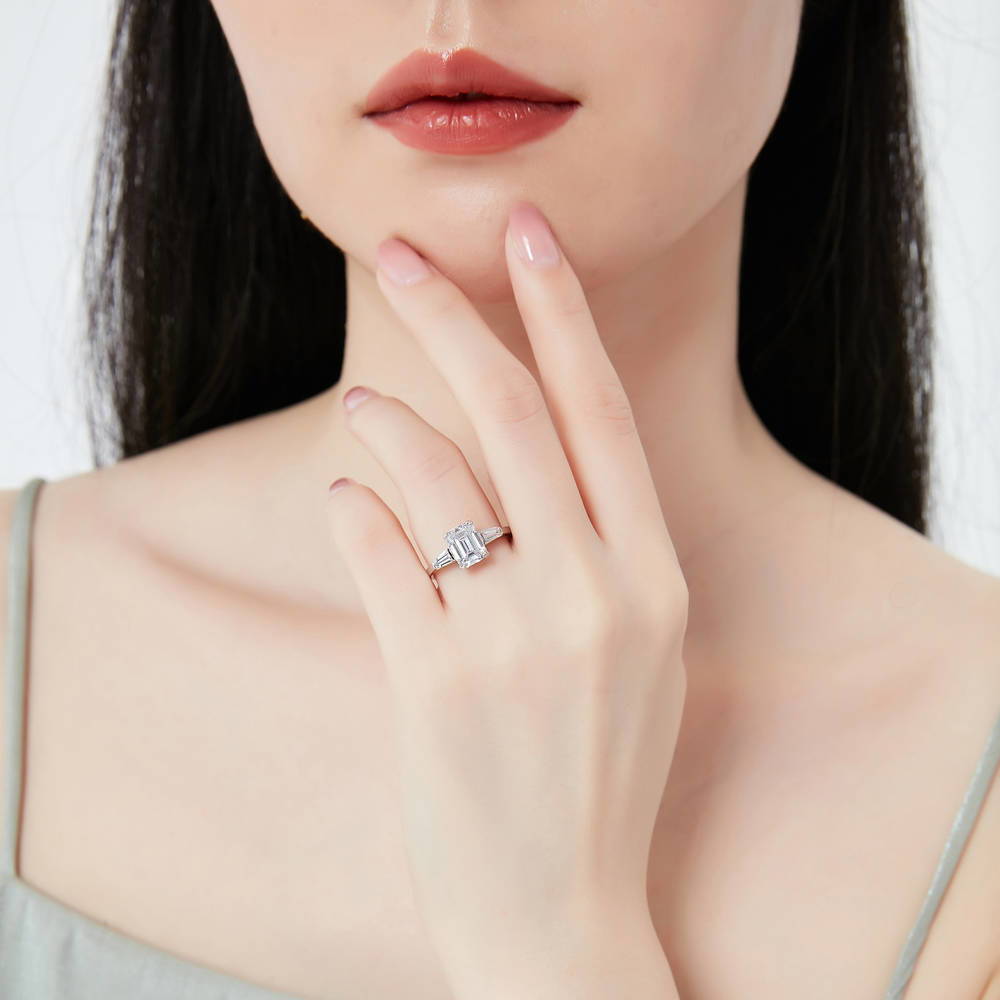 Model wearing 3-Stone Wishbone 2.1ct Emerald Cut CZ Ring Set in Sterling Silver, 12 of 20