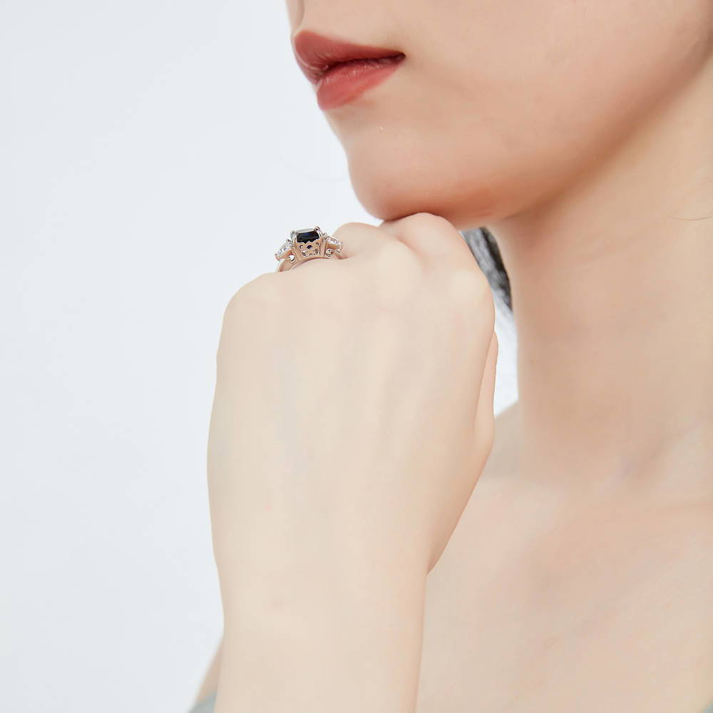 Model wearing 3-Stone 3ct Sapphire-Blue Cushion CZ Ring in Sterling Silver, 9 of 12
