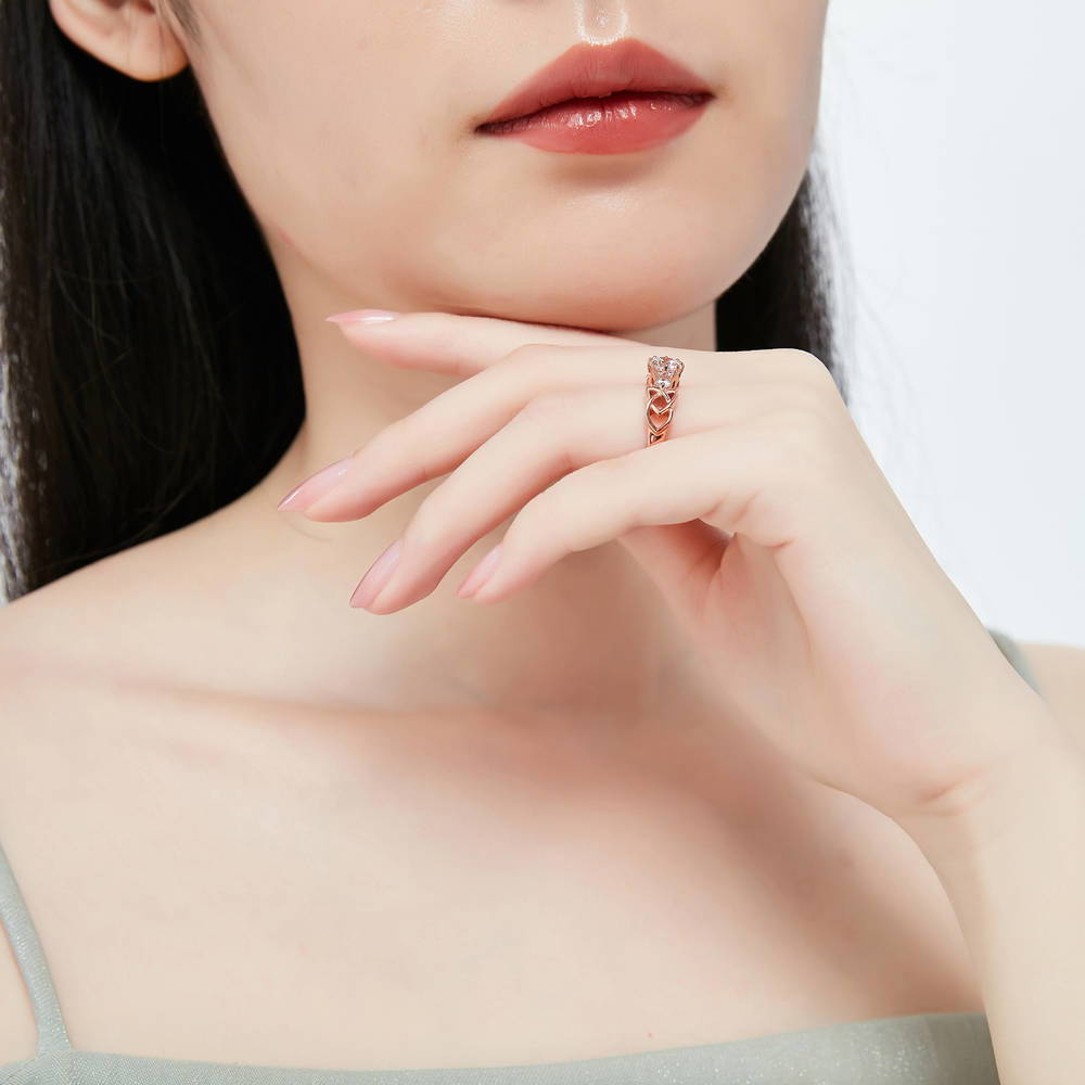 Model wearing Celtic Knot 3-Stone CZ Ring in Rose Gold Plated Sterling Silver, 6 of 8