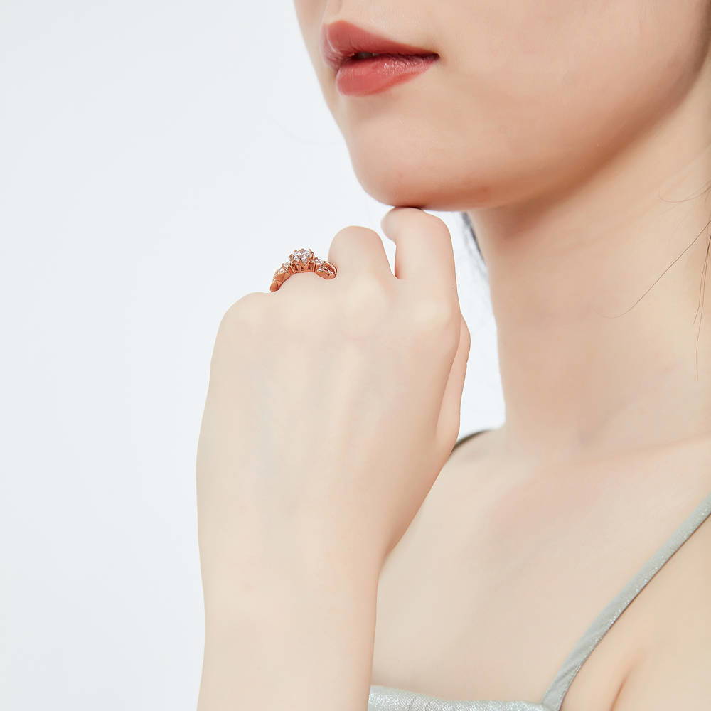 Model wearing Celtic Knot 3-Stone CZ Ring in Rose Gold Plated Sterling Silver, 3 of 8