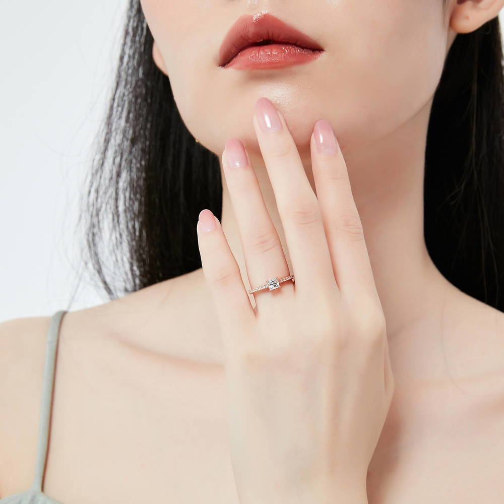 Model wearing Solitaire Princess CZ Ring in Rose Gold Plated Sterling Silver, 2 of 8