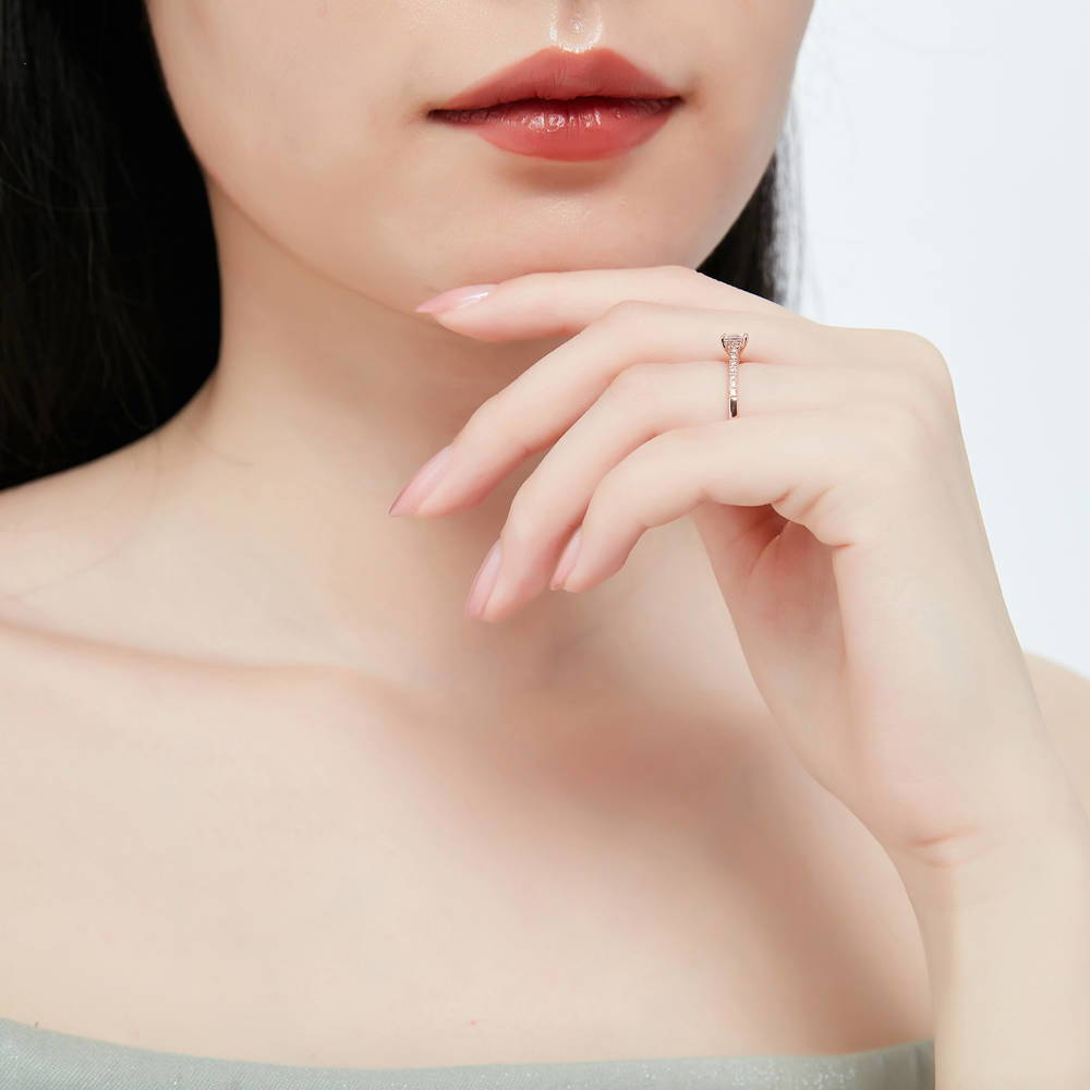 Model wearing Solitaire 0.4ct Princess CZ Ring in Rose Gold Plated Sterling Silver, 6 of 8