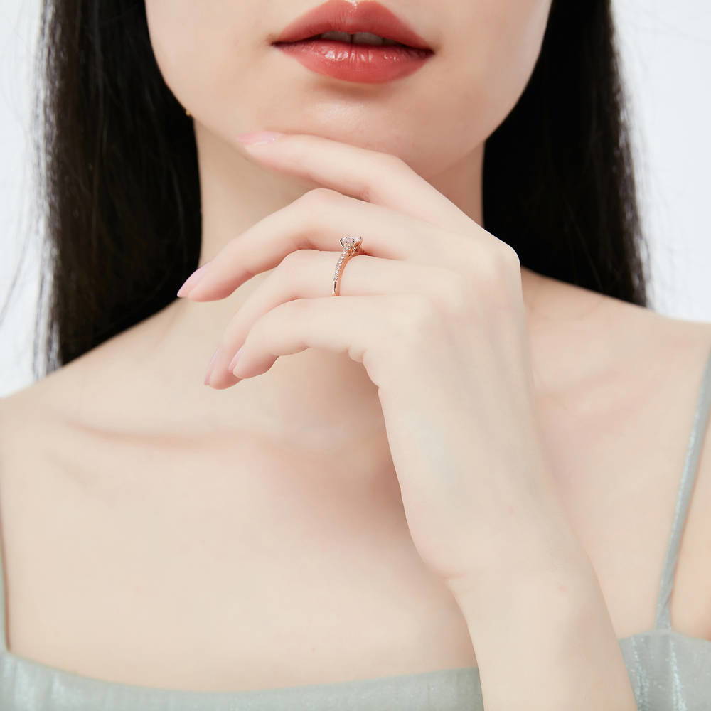 Model wearing Solitaire Princess CZ Ring in Rose Gold Plated Sterling Silver, 3 of 8