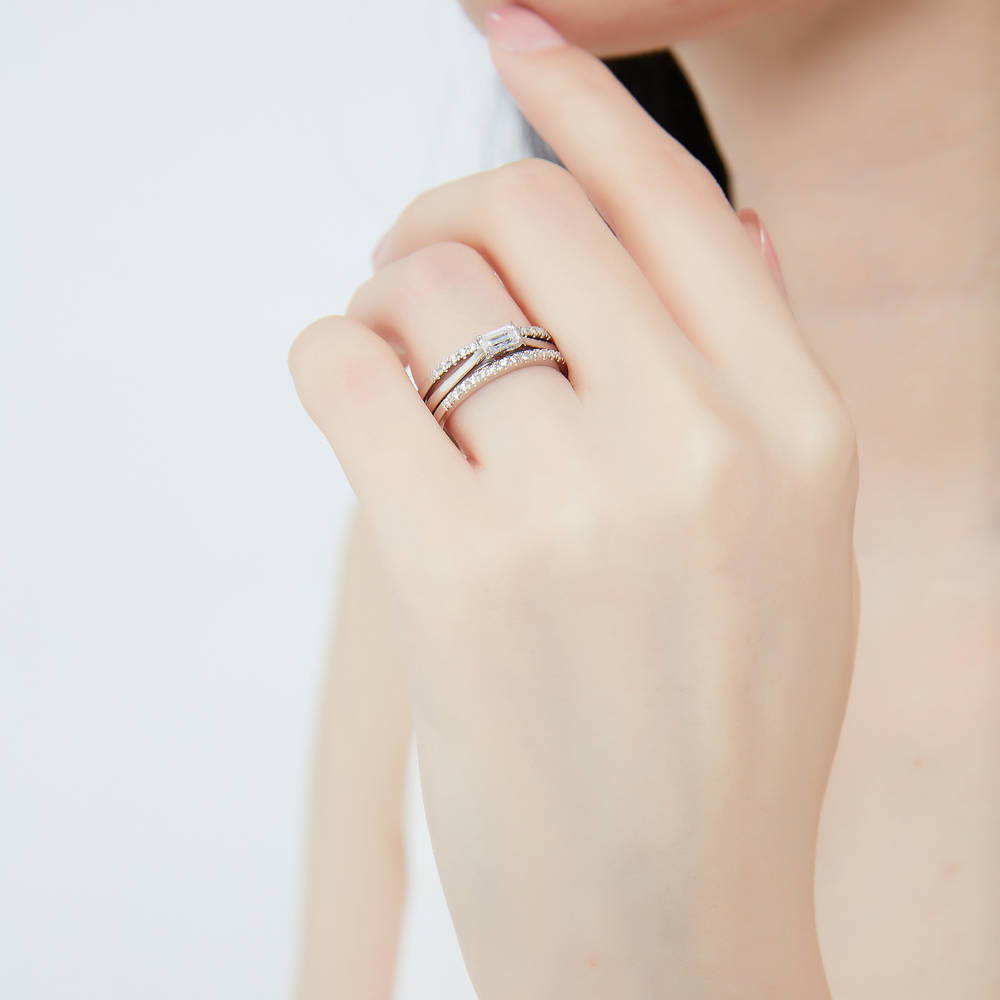 Model wearing Solitaire East-West 0.3ct Emerald Cut CZ Ring in Sterling Silver, 12 of 14