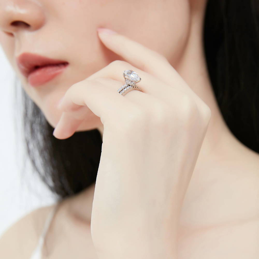 Model wearing Solitaire Hidden Halo 1.8ct Pear CZ Ring Set in Sterling Silver, 6 of 13