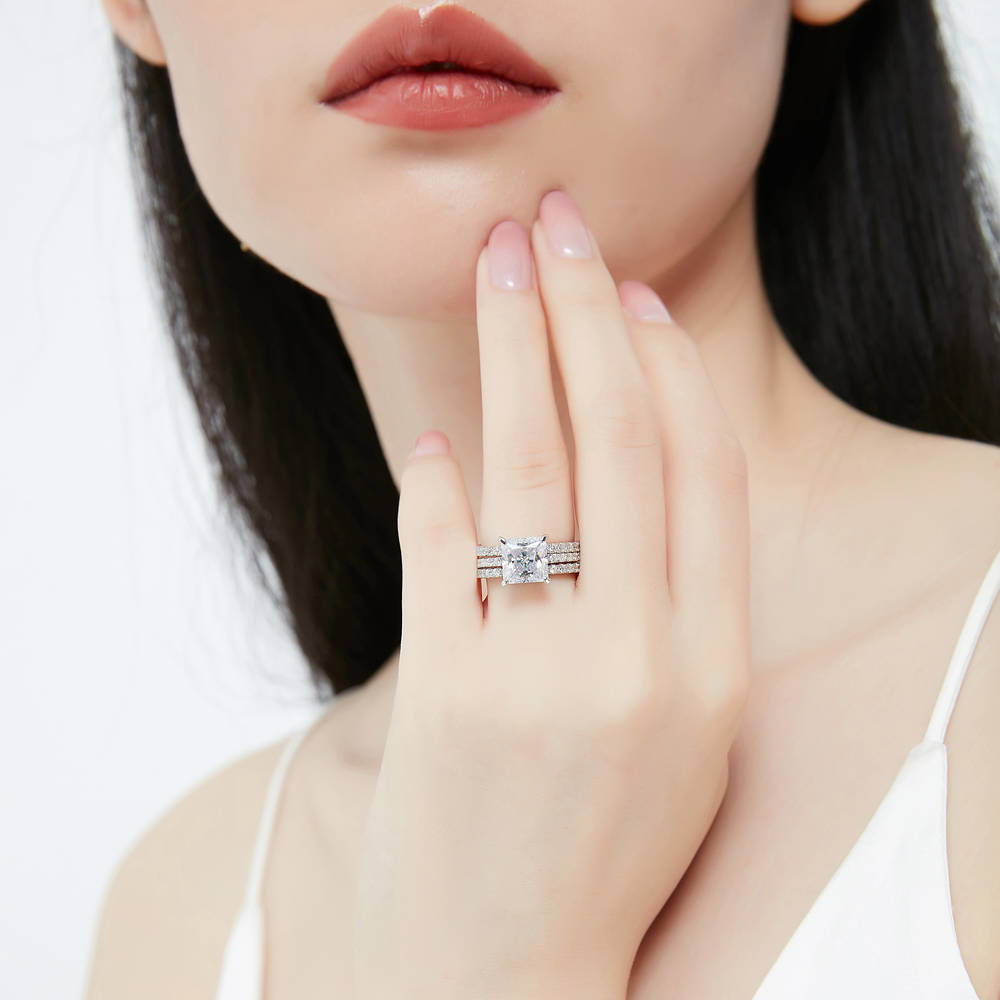 Model wearing Hidden Halo Solitaire CZ Ring Set in Sterling Silver, 2 of 13
