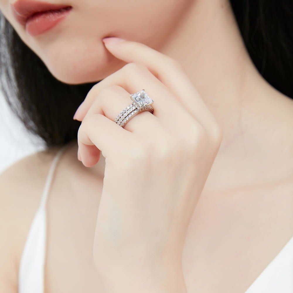 Model wearing Hidden Halo Solitaire CZ Ring Set in Sterling Silver, 7 of 13