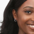 Model wearing Oval Bar CZ Small Hoop Earrings in Sterling Silver 0.7 inch, Yellow Gold Flashed