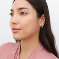 Model wearing Oval Bar CZ Small Hoop Earrings in Sterling Silver 0.6 inch, Yellow Gold Flashed