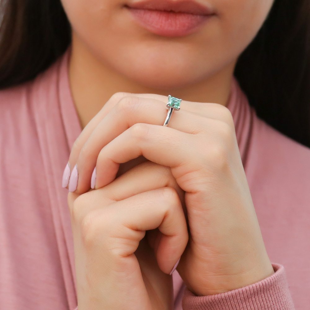 Model wearing Solitaire 1.2ct Green Princess CZ Ring in Sterling Silver, 7 of 9