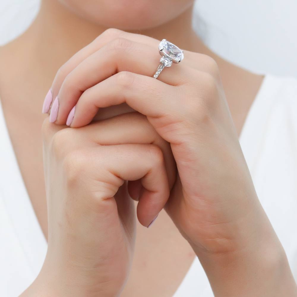 Model wearing 3-Stone 5.5ct Oval CZ Ring in Sterling Silver, 9 of 12