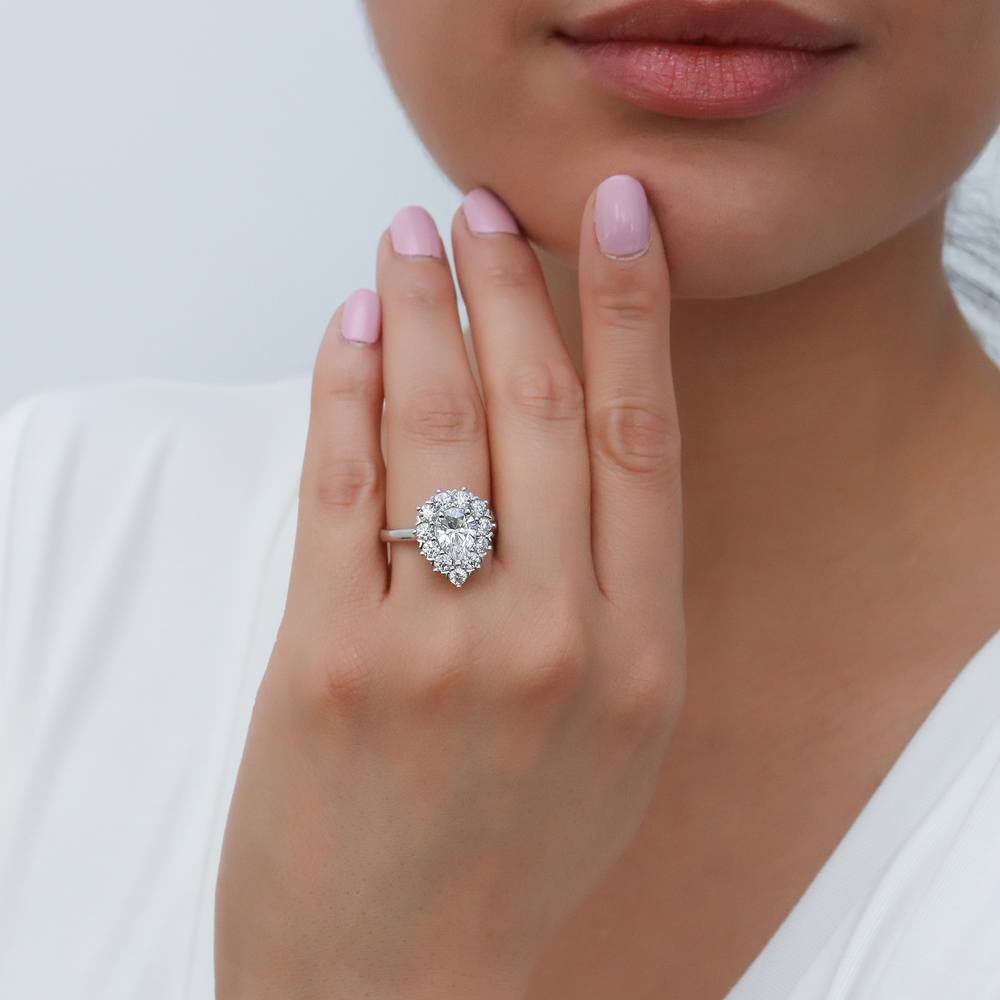Model wearing Halo Pear Cut CZ Ring in Sterling Silver, 6 of 13