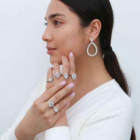 Model Wearing 3-Stone Ring, Art Deco Ring, Halo Ring, Teardrop Dangle Earrings