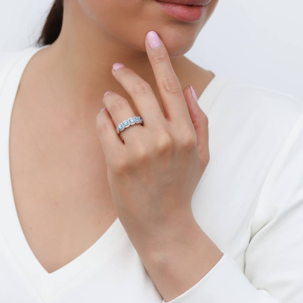 Model wearing 5-Stone Simulated Aquamarine CZ Ring in Sterling Silver, 2 of 9