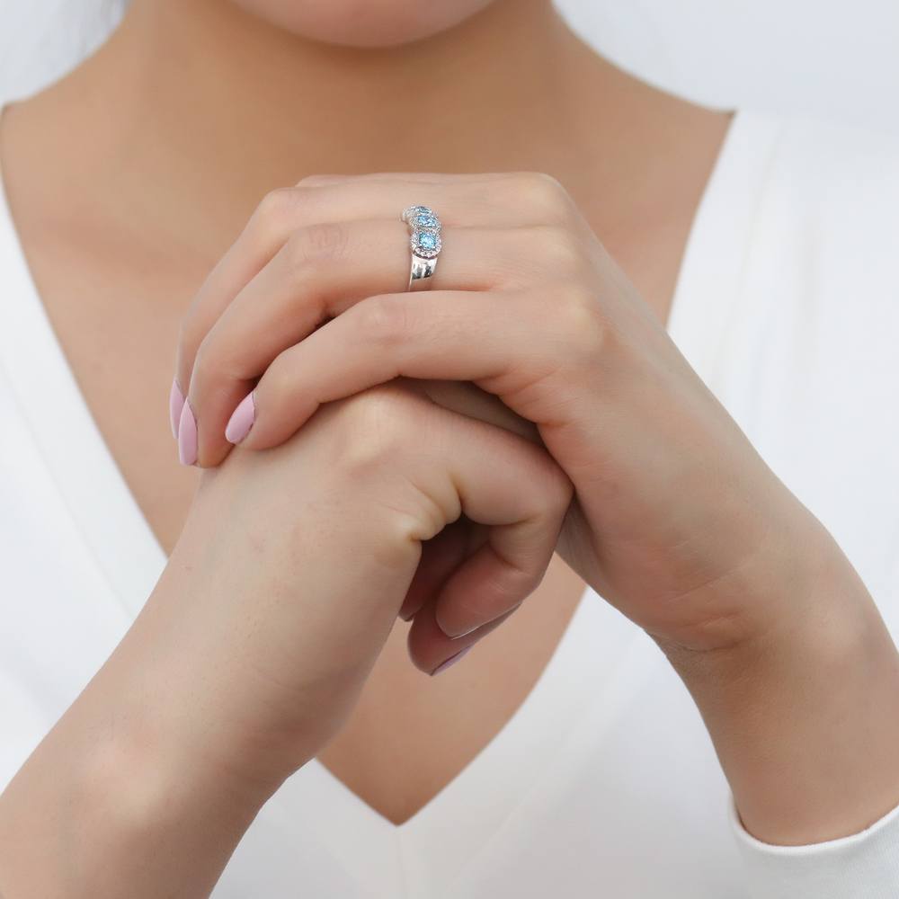 Model wearing 5-Stone Simulated Aquamarine CZ Ring in Sterling Silver, 7 of 9