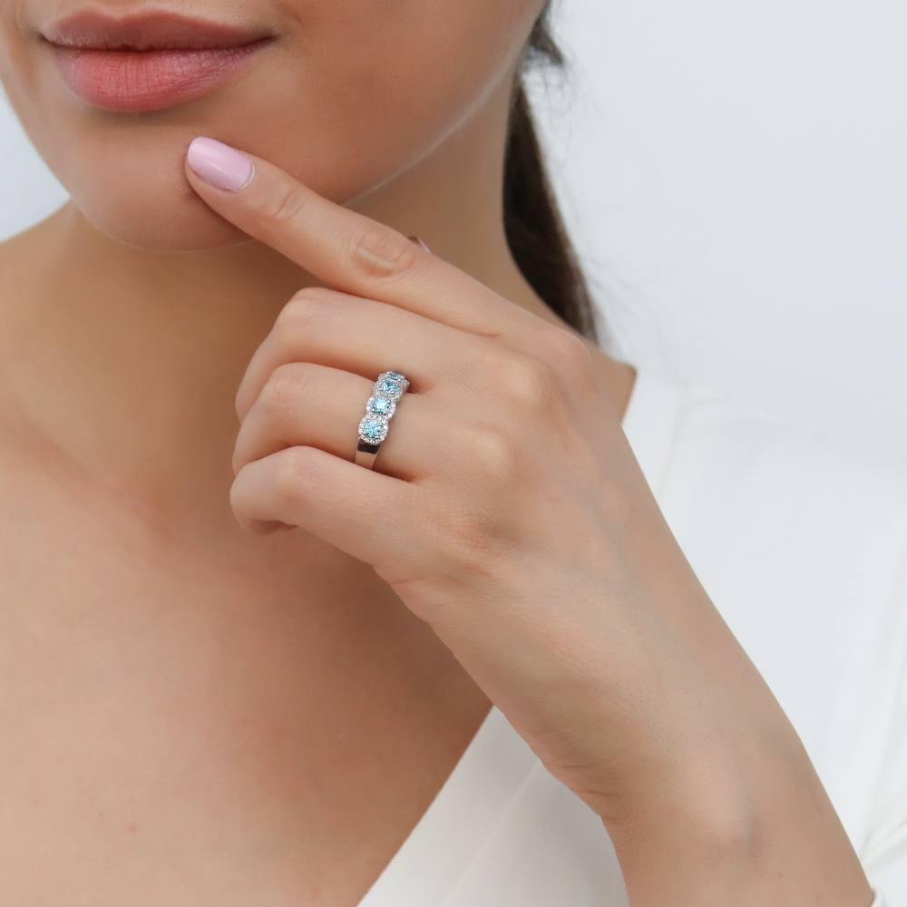 Model wearing 5-Stone Simulated Aquamarine CZ Ring in Sterling Silver, 6 of 9